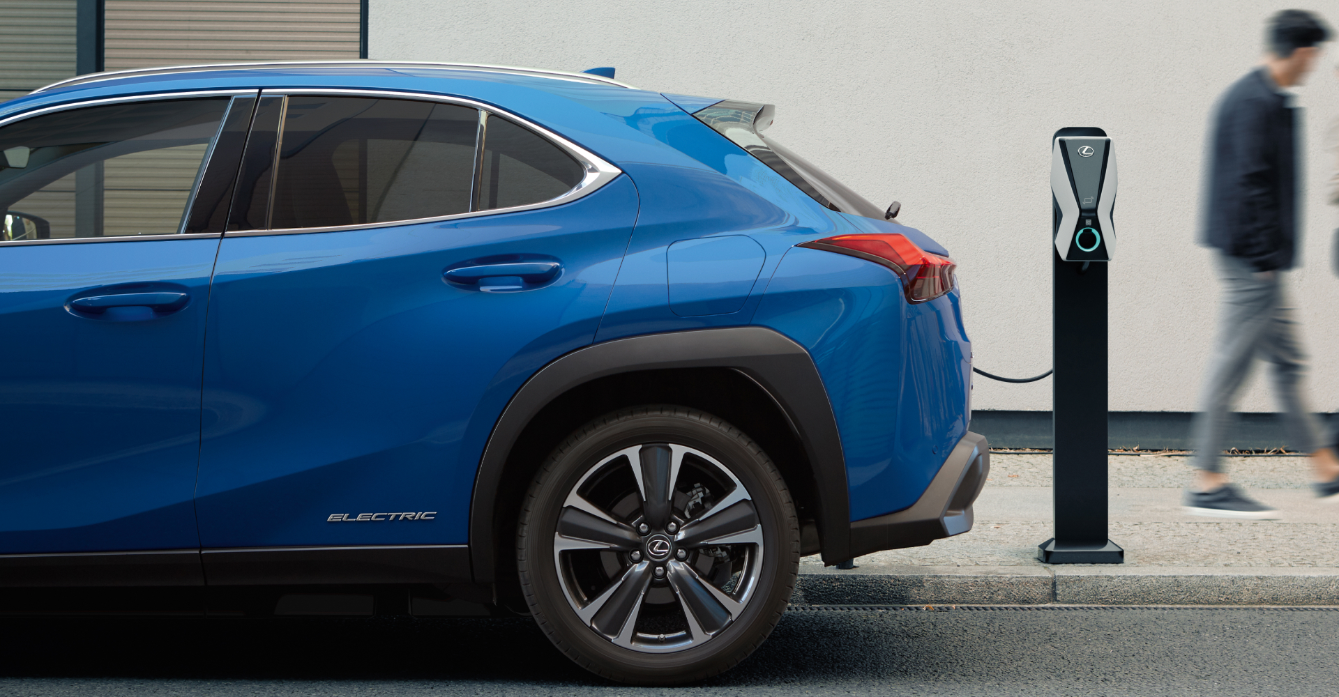 Lexus UX EV charging in daylight