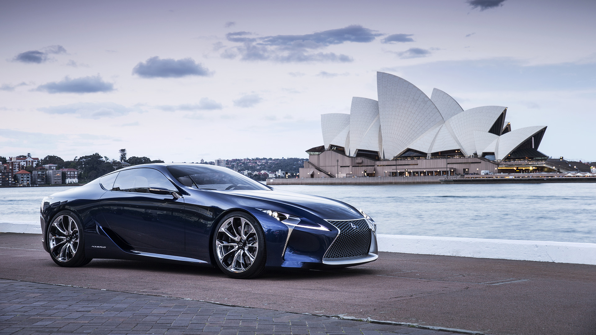 Black Lexus LF-LC Blue concept vehicle parked in front of the Sydney Opera House