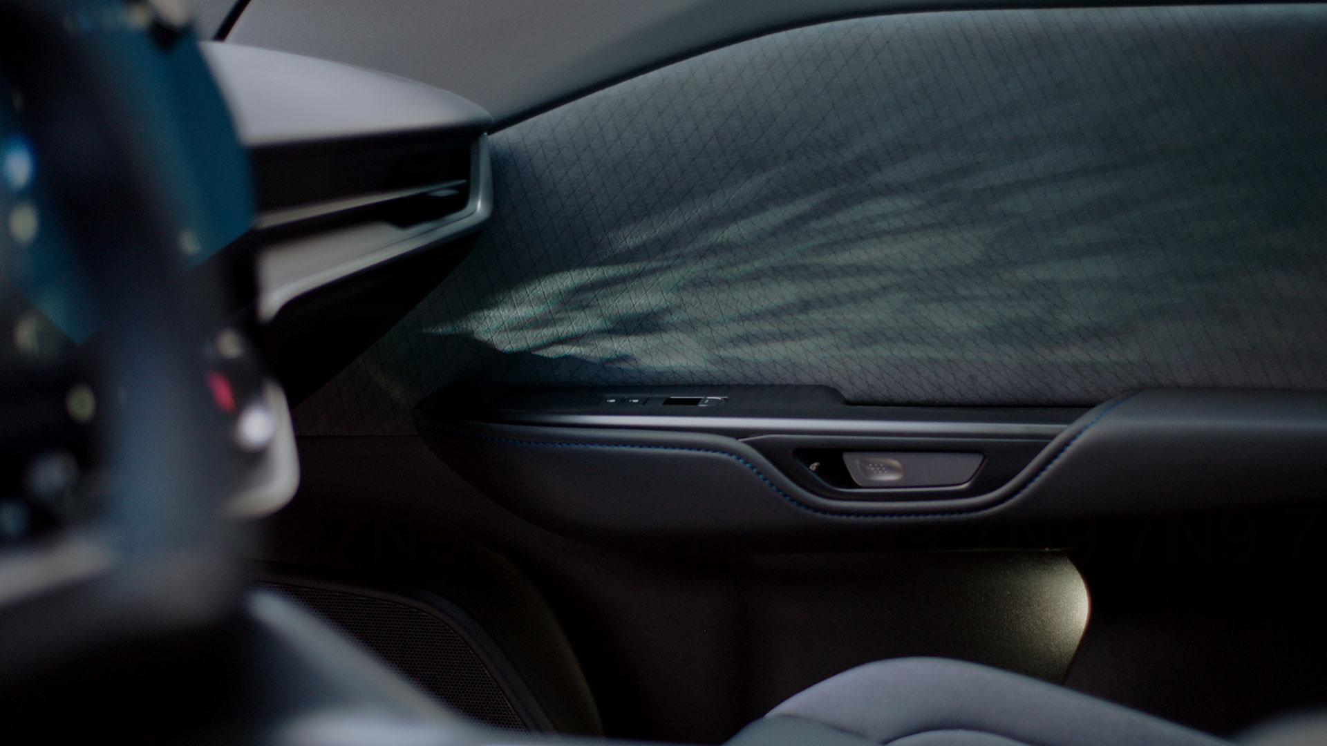 Interior of  the Lexus RZ with vehicle passenger door detail.