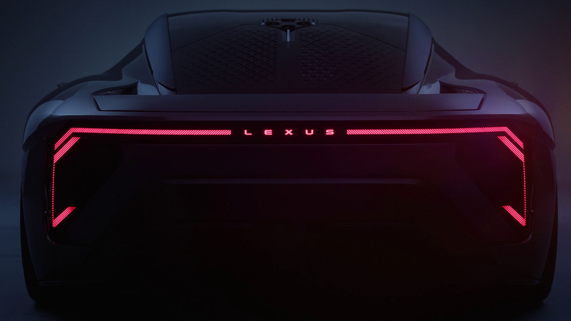 Rear view of the Lexus LFA Concept with illuminated Lexus lettering and full-width rear light bar