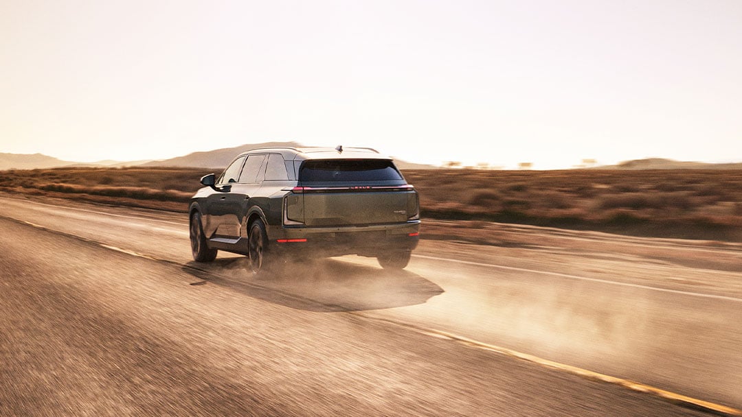 Lexus TZ driving along a dusty road